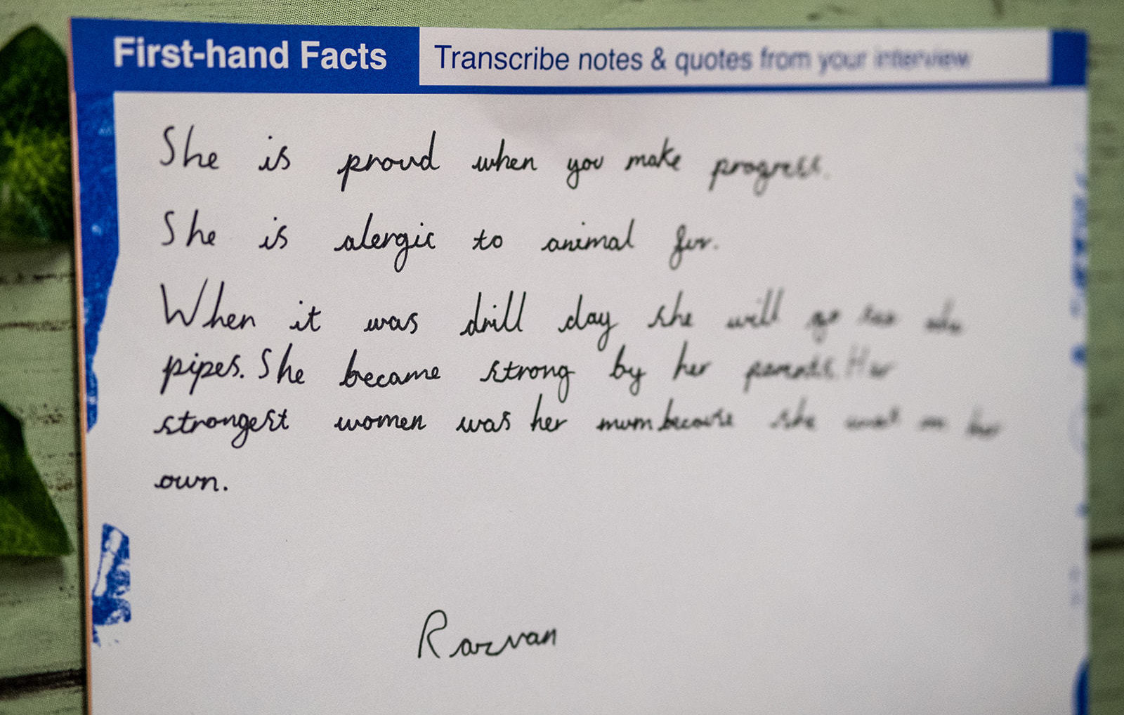 A sheet of paper that reads 'Transcribe notes & quotes from your interview: She is proud when you make progress, she is allergic to animal fur' The rest is out of focus and cannot be deciphered.